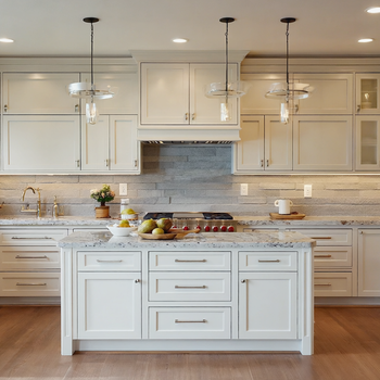 Modern white shaker kitchen with marble island, pendant lighting, stainless steel appliances and gray stone backsplash